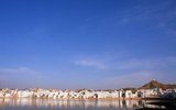 Pushkar is one of India's oldest cities. The date of its actual founding is not known, but legend associates Lord Brahma with its creation.<br/><br/>

According to the Rajputana Gazetteer, Pushkar was held by Chechi Gurjars (Gujjars) till about 700 years ago. Later Some shrines were occupied by Kanphati Jogis. There are still some priests from the Gujar community in some of Pushkar's temples. They are known as Bhopas.<br/><br/>

The sage Parasara is said to have been born in Pushkar. His descendants, called Parasara Brahamanas, are found in Pushkar and the surrounding area. The famous temple of Jeenmata has been cared for by Parasara Brahmans for the last 1,000 years. Pushkarana Brahamanas may also have originated here.<br/><br/>

It is also the venue of the annual Pushkar Camel Fair.